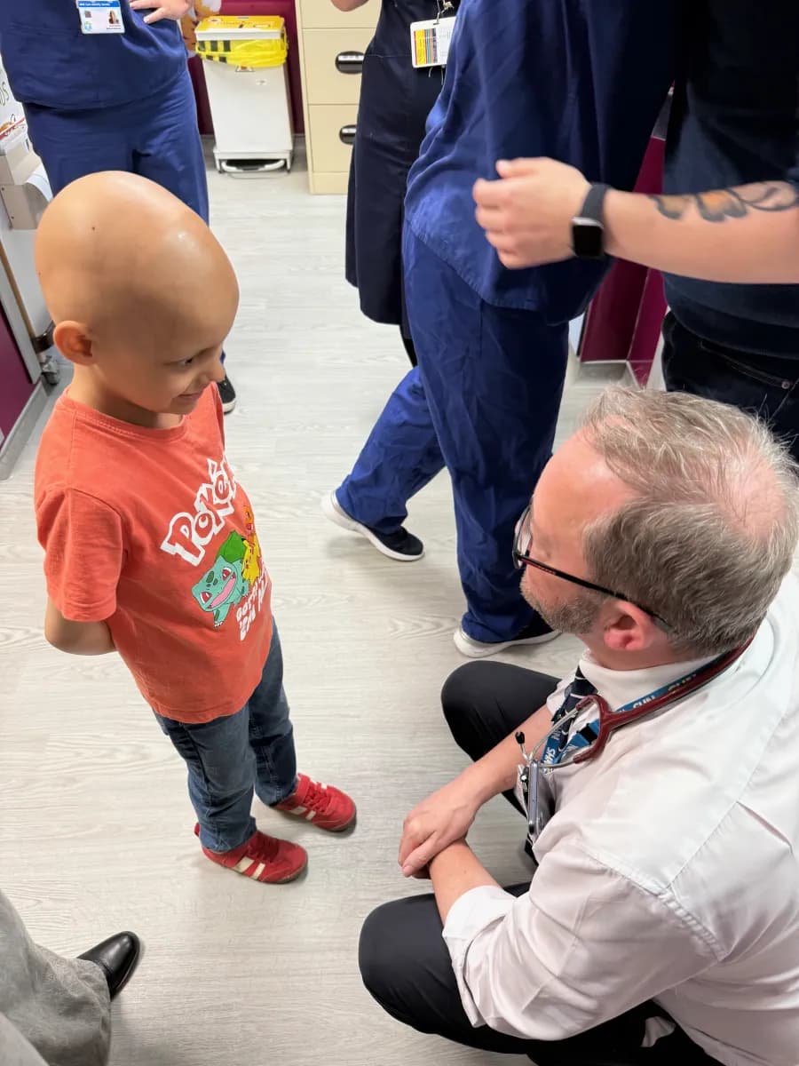 Dr Cunningham congratulating Aleks on completing his treatment