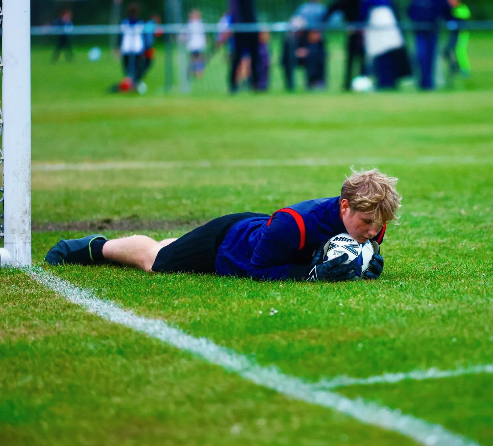 Match action – a diving save from the goalkeeper
