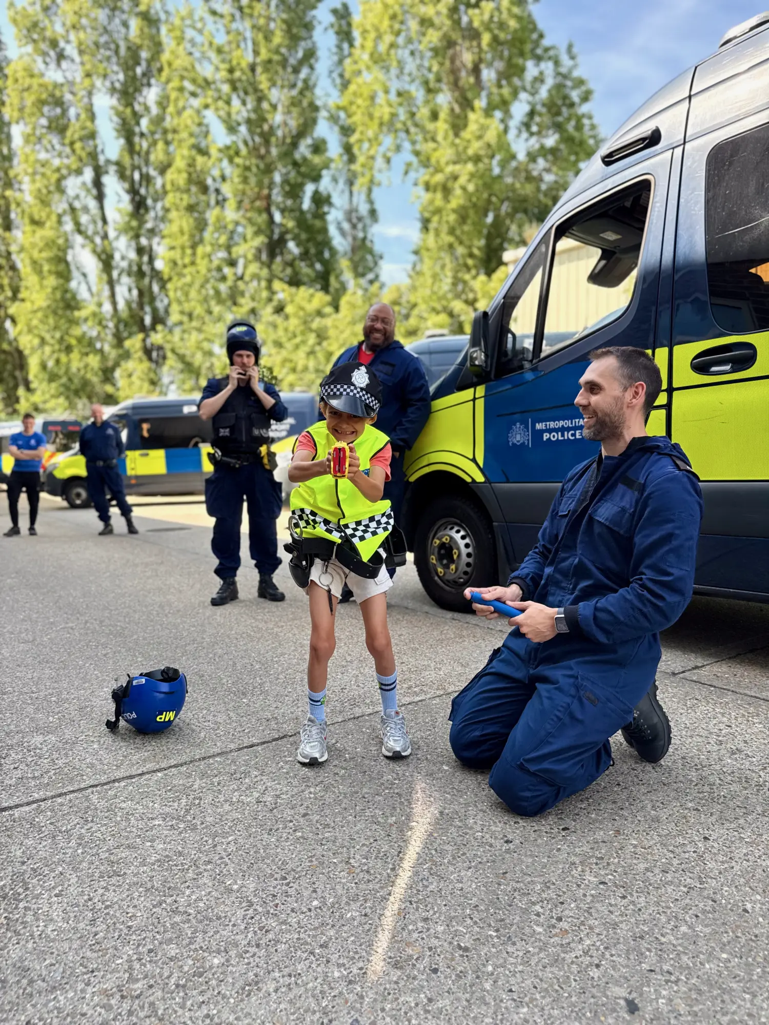 4TSG gear him up for the job, laughing as he is handed a public-order helmet.