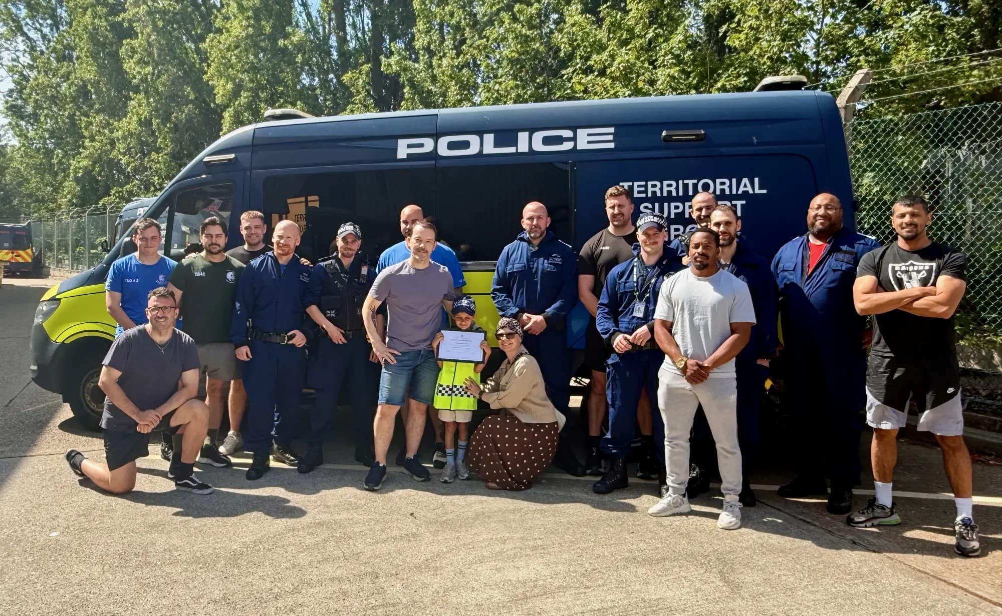 The whole 4TSG team, role-players and all, with the day's bravest recruit front and centre.