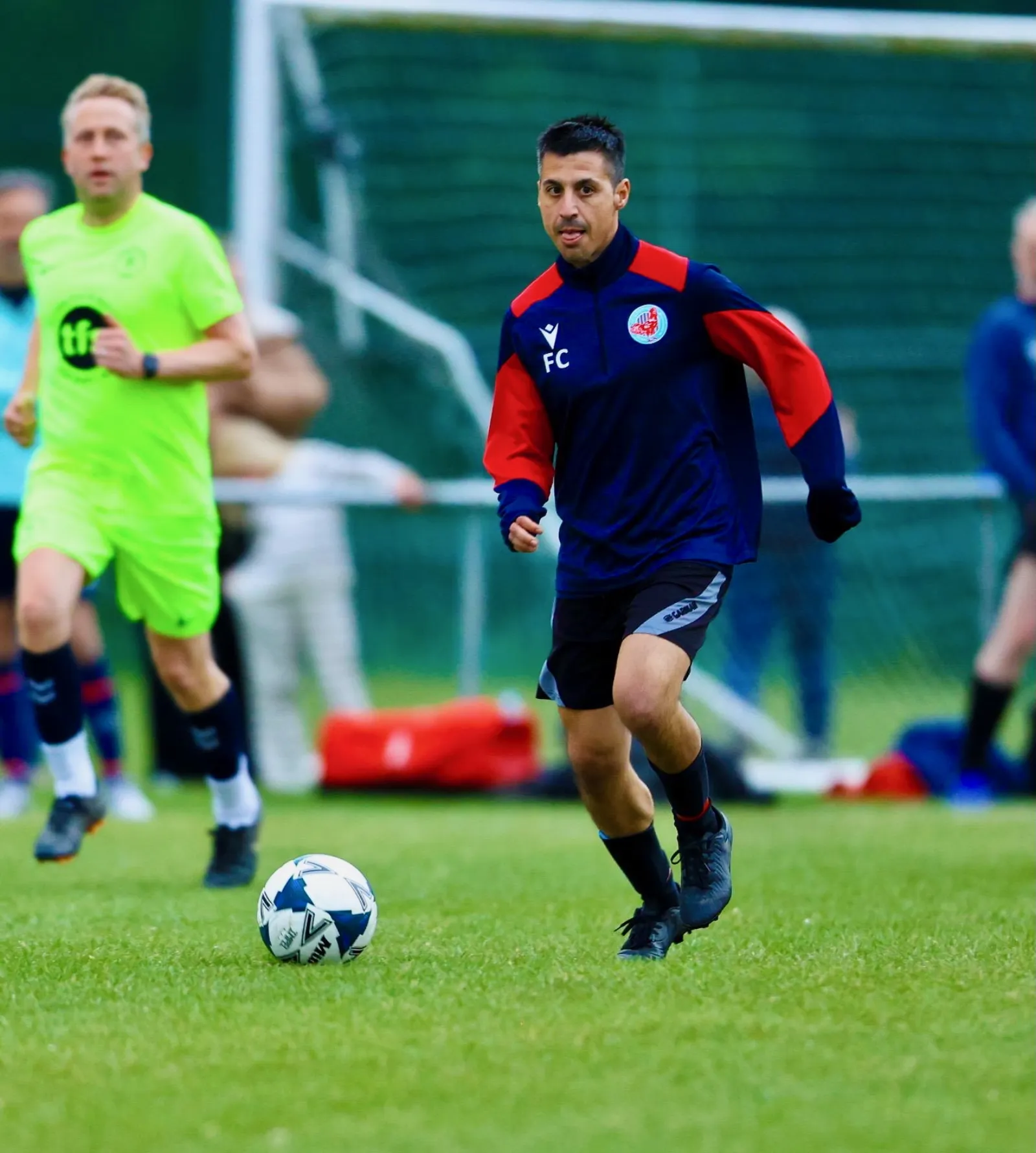 FC Elmstead coach on the ball, with Baldon Sports in pursuit