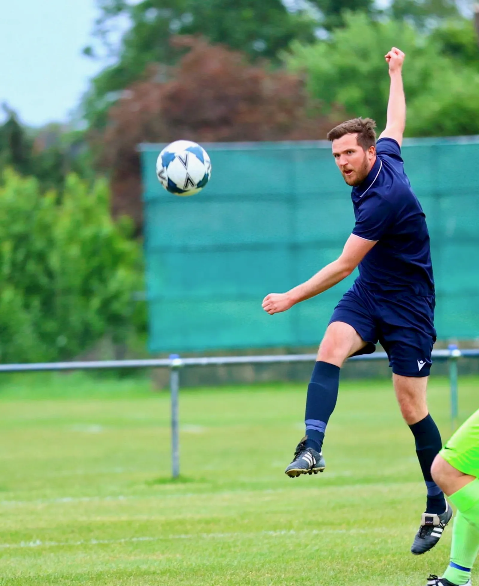 Athletic header from an FC Elmstead player