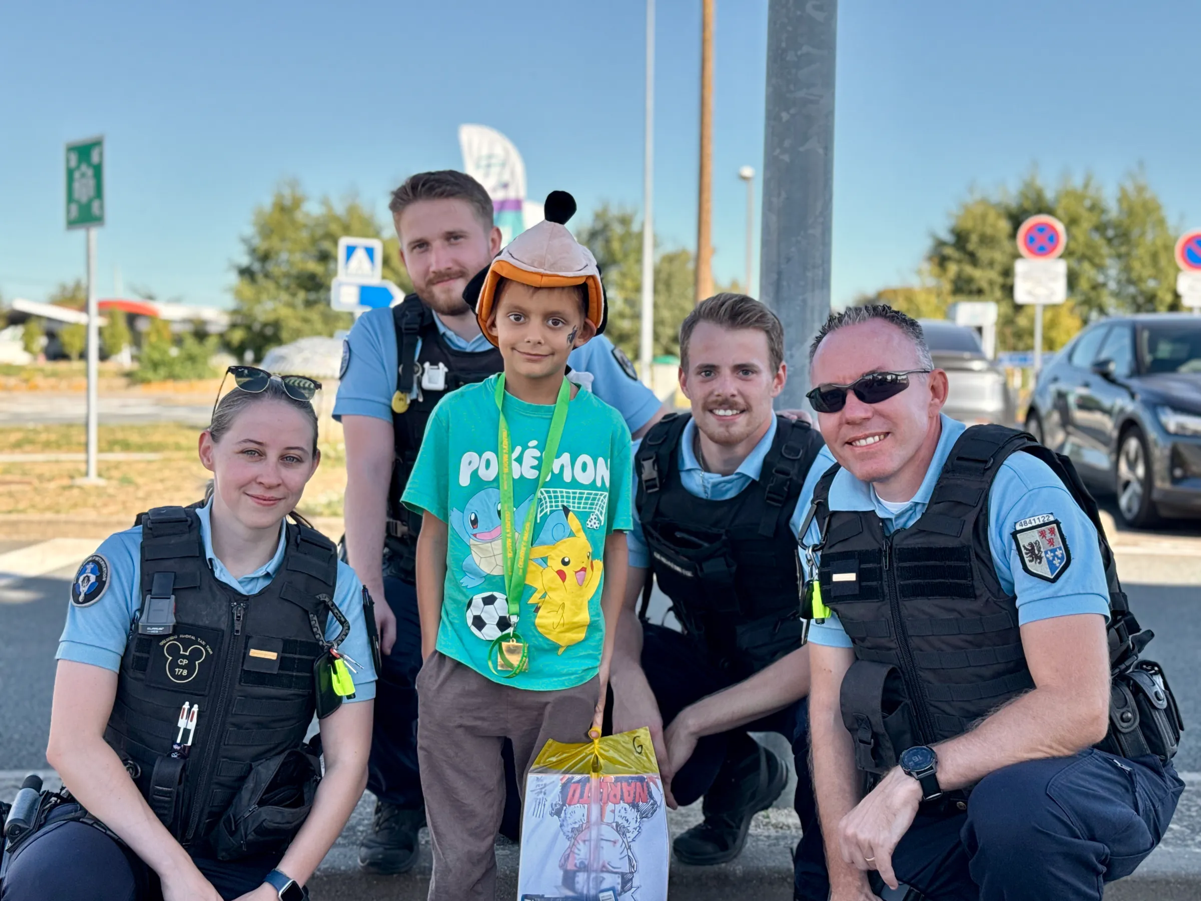 Face paint done, Aleks lines up with four officers of the Gendarmerie before we set off again.