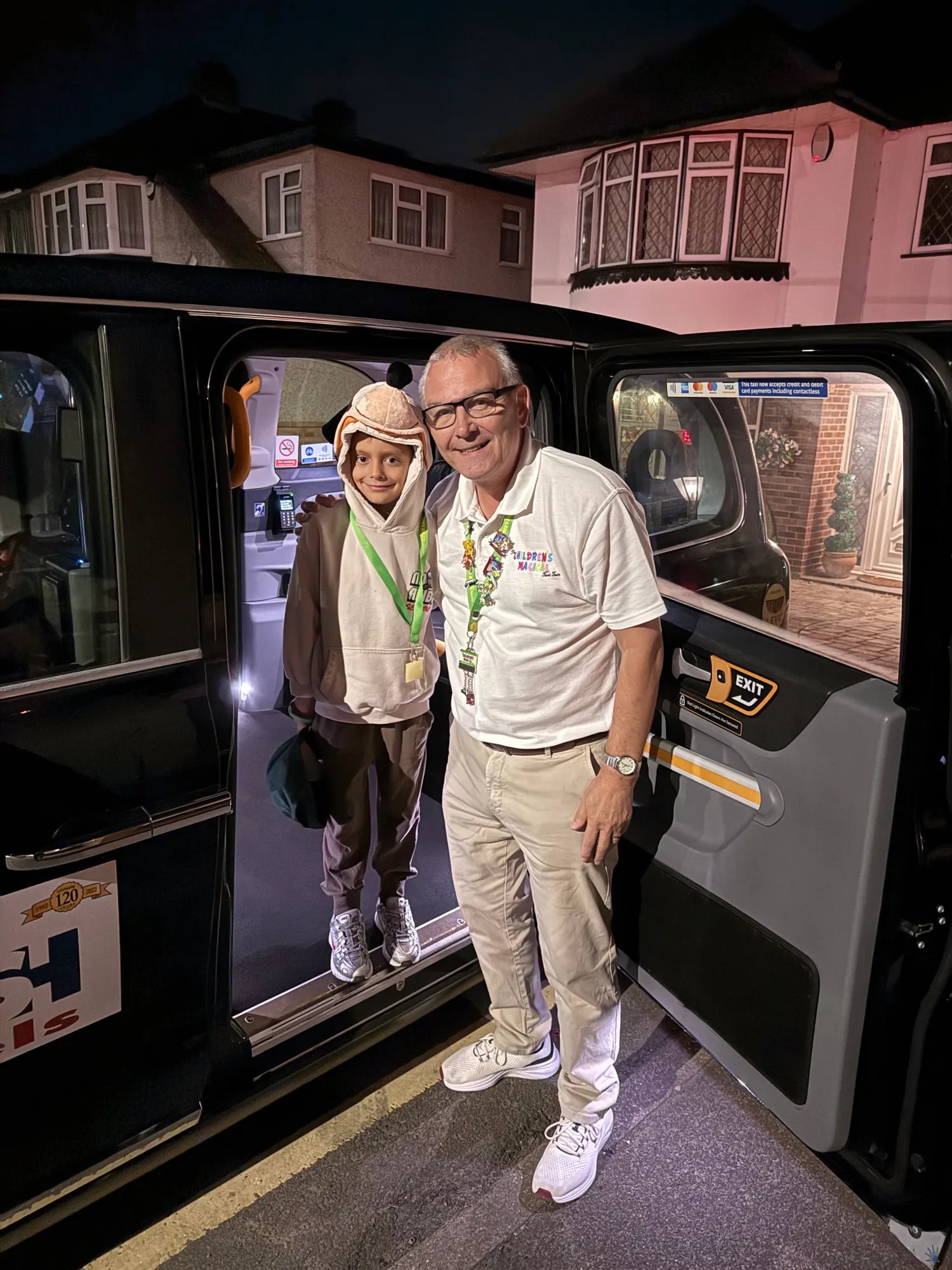 Half past four on Friday morning, and Craig and his cab are already at our door. Aleks, hood up, is ready.