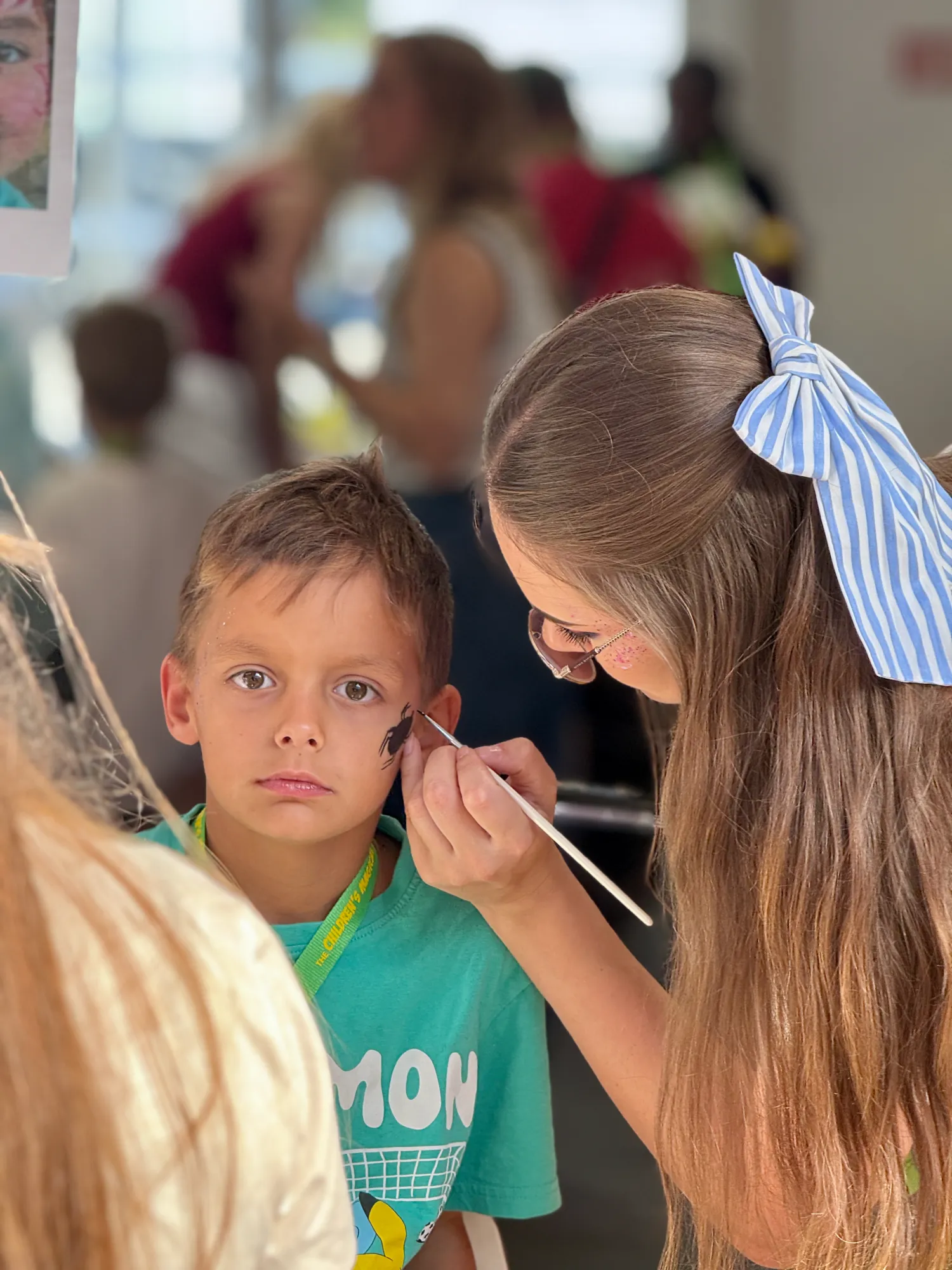 Very serious concentration while Aleks gets his face painted at Assevillers.