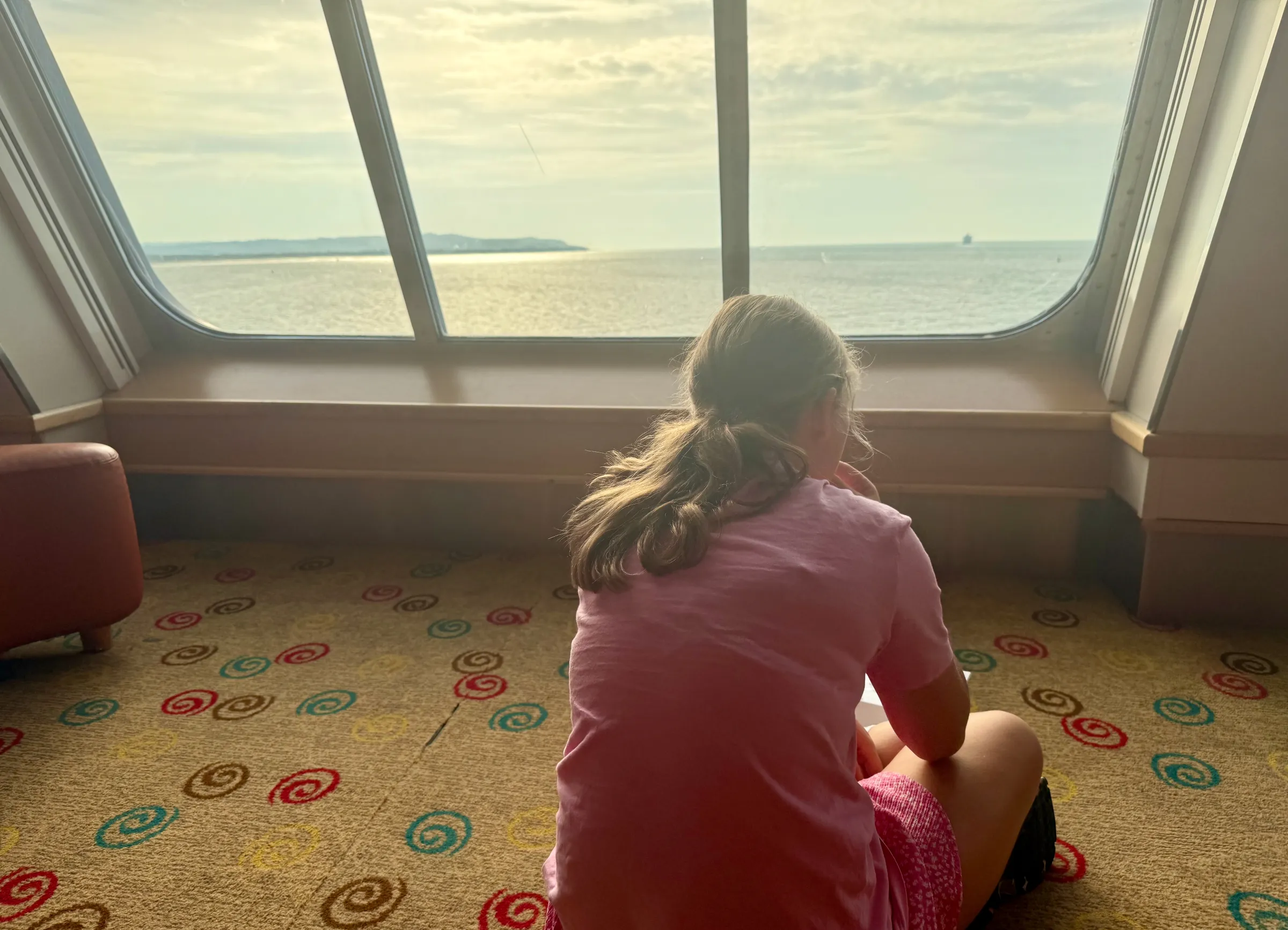 Nikola watches the coast come into view on the ferry home.
