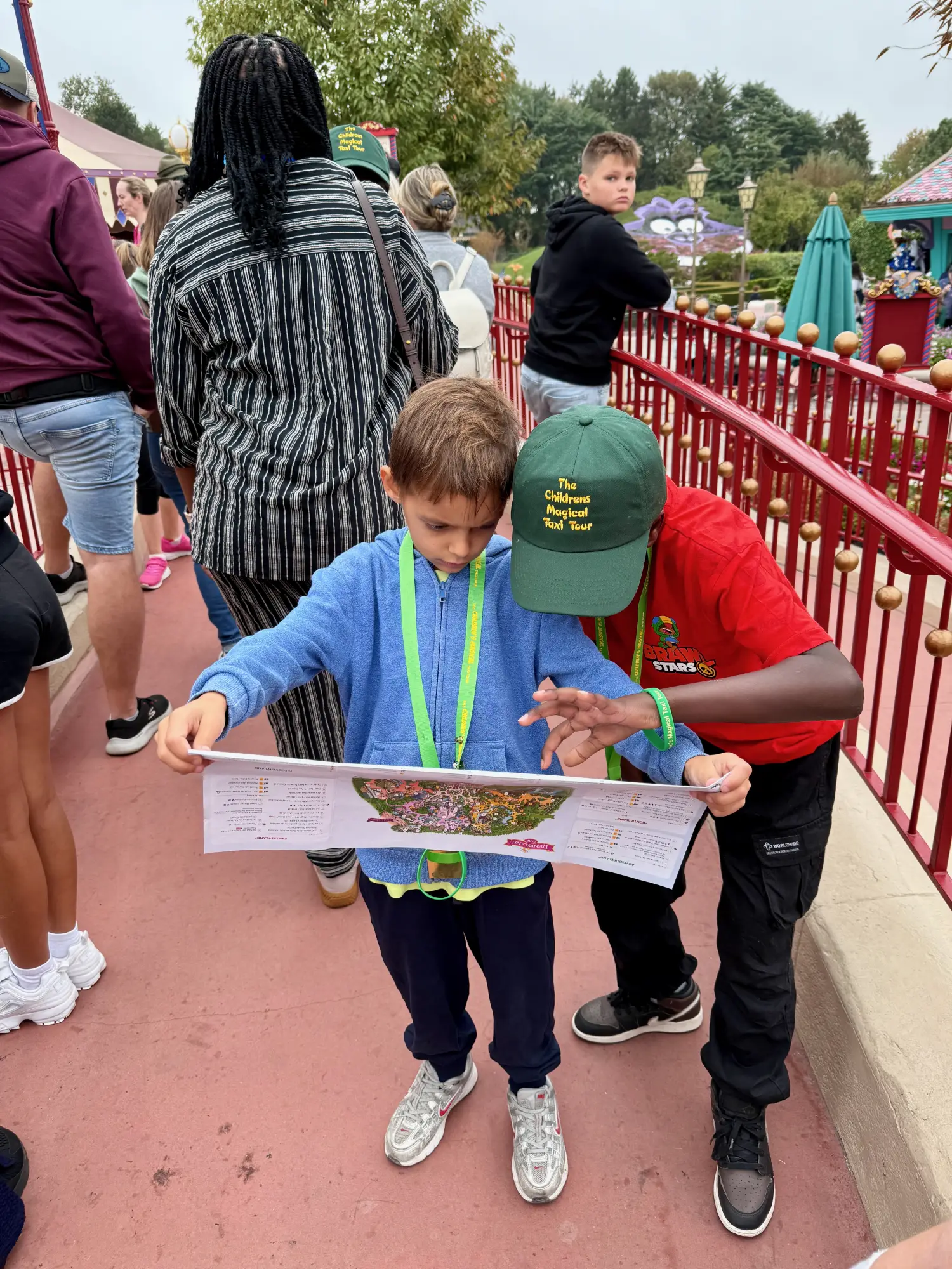 Aleks and a new friend from the tour plan their attack on the park map. Scariest rides first, obviously.
